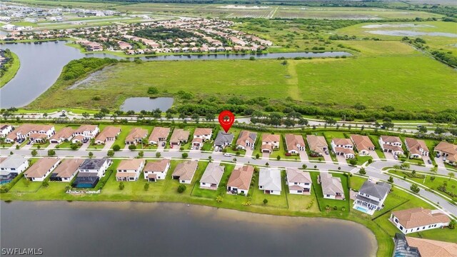 birds eye view of property featuring a water view