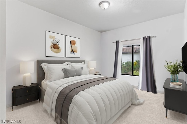 bedroom featuring light colored carpet