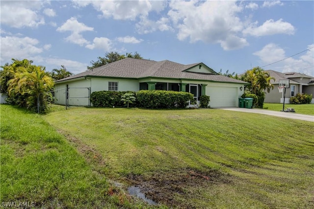 ranch-style house featuring a front yard and a garage