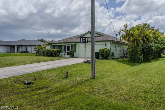 single story home featuring a garage and a front yard