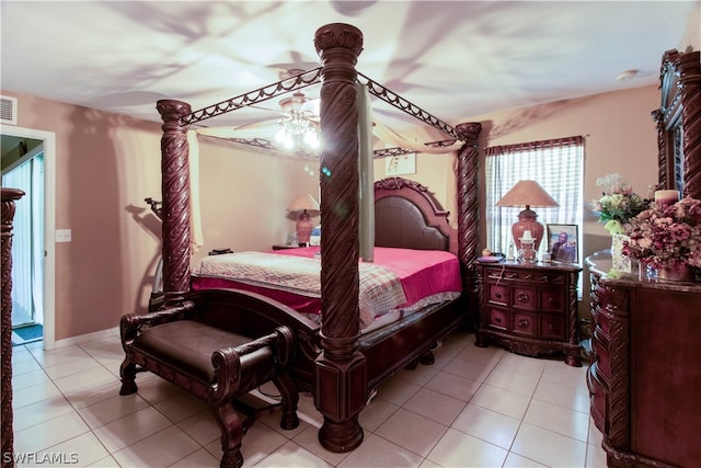 tiled bedroom featuring ceiling fan