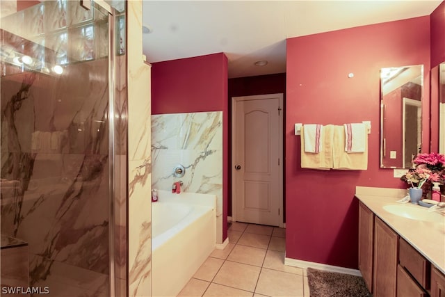 bathroom with shower with separate bathtub, tile patterned floors, and vanity