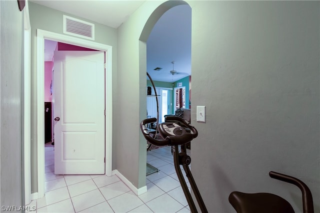 hall featuring light tile patterned floors