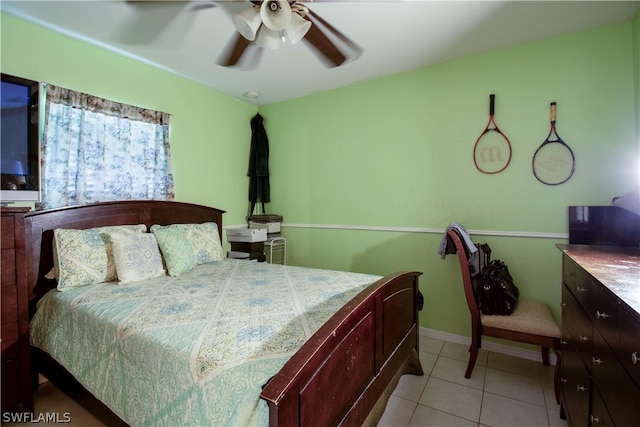 tiled bedroom with ceiling fan