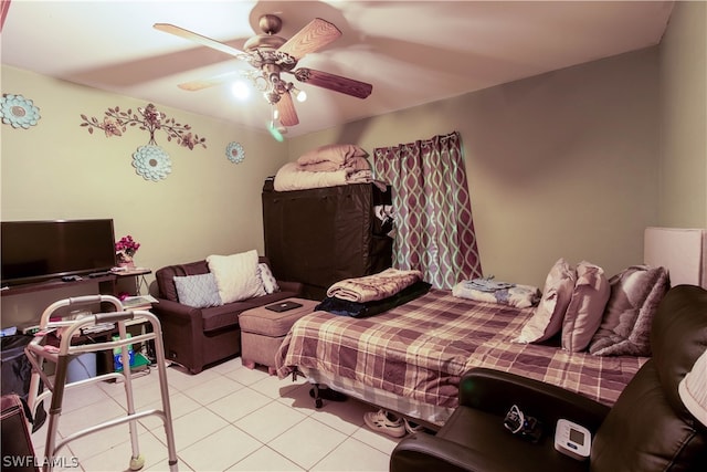 tiled bedroom featuring ceiling fan