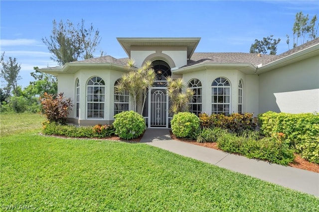 entrance to property with a yard