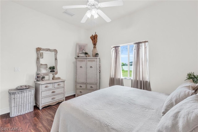 bedroom with ceiling fan and dark hardwood / wood-style floors