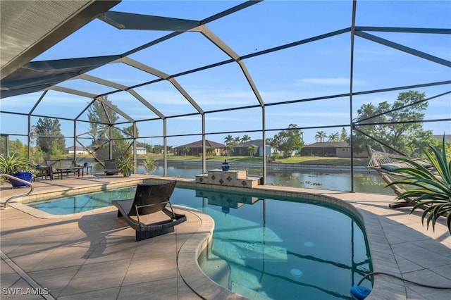 view of swimming pool featuring a lanai, a patio area, and a water view