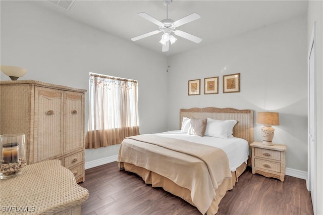 bedroom featuring dark hardwood / wood-style flooring and ceiling fan