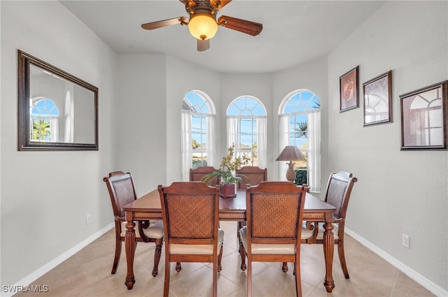 dining room with ceiling fan and light tile patterned floors