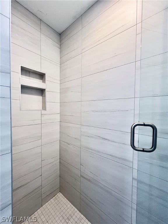 bathroom with a shower stall