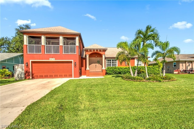 view of front of house featuring a garage and a front yard