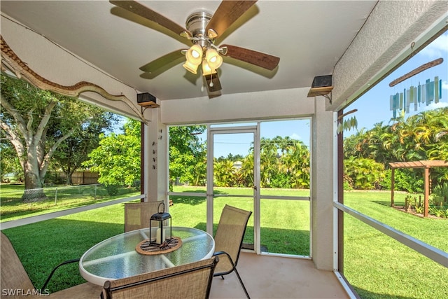 exterior space featuring ceiling fan