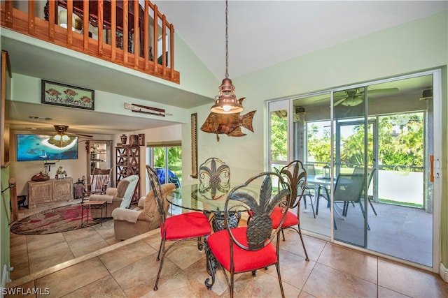 tiled dining room featuring high vaulted ceiling and ceiling fan