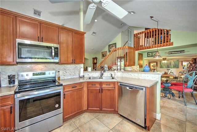 kitchen featuring ceiling fan, high vaulted ceiling, sink, appliances with stainless steel finishes, and backsplash