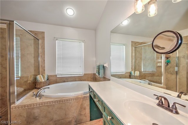 bathroom with a healthy amount of sunlight, shower with separate bathtub, and vanity