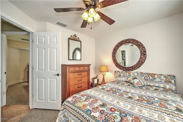 bedroom with a closet, carpet floors, and ceiling fan