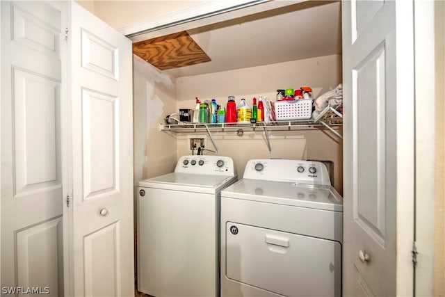 laundry area with washing machine and clothes dryer