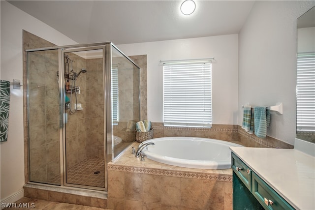 bathroom featuring independent shower and bath and vanity