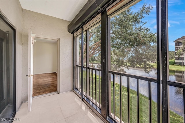 900 Arbor Lake Dr Unit 206, Naples, FL 34110 - unfurnished sunroom featuring a water view