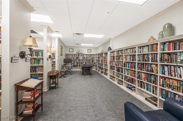 900 Arbor Lake Dr Unit 206, Naples, FL 34110 - living area featuring dark colored carpet and a paneled ceiling