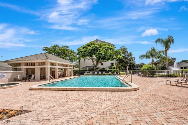 900 Arbor Lake Dr Unit 206, Naples, FL 34110 - view of swimming pool with a patio