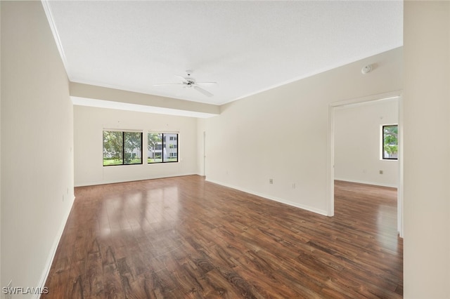 empty room with ceiling fan and hardwood / wood-style floors