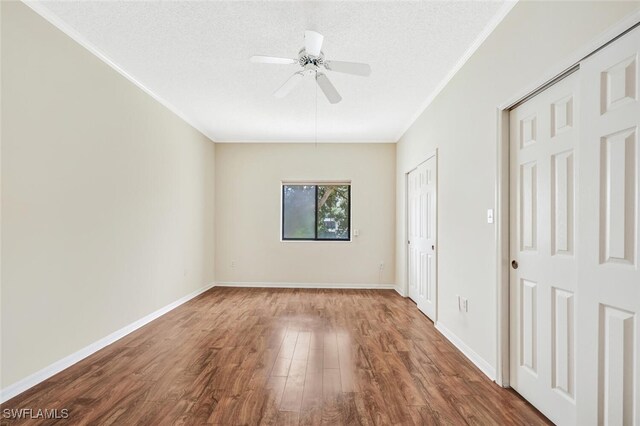 900 Arbor Lake Dr Unit 206, Naples, FL 34110 - unfurnished room with hardwood / wood-style flooring, ceiling fan, ornamental molding, and a textured ceiling