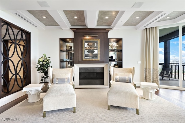 living room with coffered ceiling, wood-type flooring, and beam ceiling