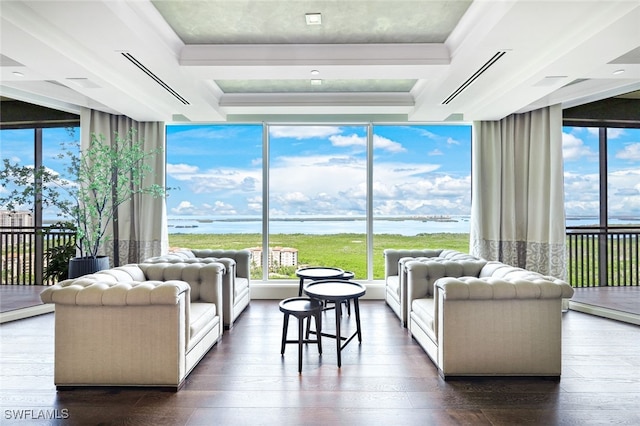 living room featuring a water view, floor to ceiling windows, and dark hardwood / wood-style floors