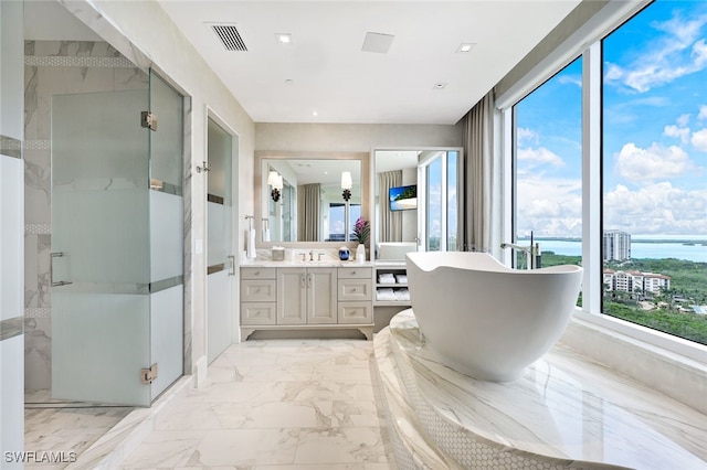 4800 Pelican Colony Blvd Unit Ph2103, Bonita Springs, FL 34134 - bathroom with marble finish flooring, a water view, a stall shower, vanity, and a soaking tub