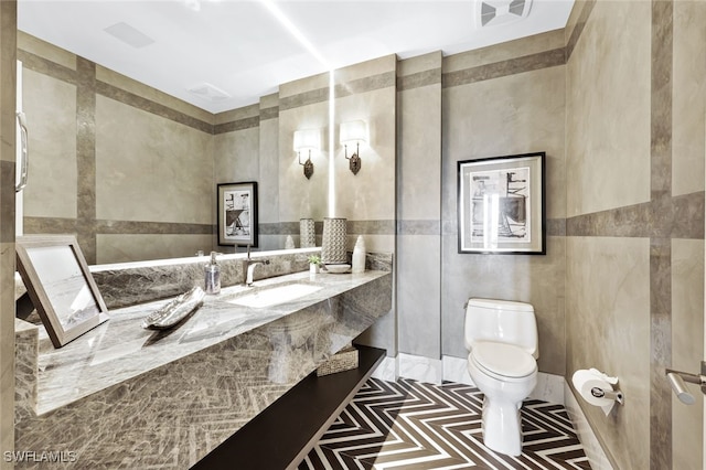 4800 Pelican Colony Blvd Unit Ph2103, Bonita Springs, FL 34134 - bathroom featuring toilet, tile walls, and vanity