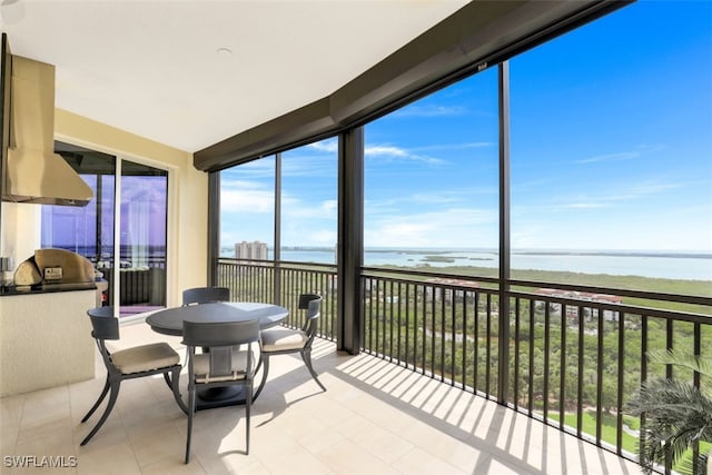 sunroom with a water view