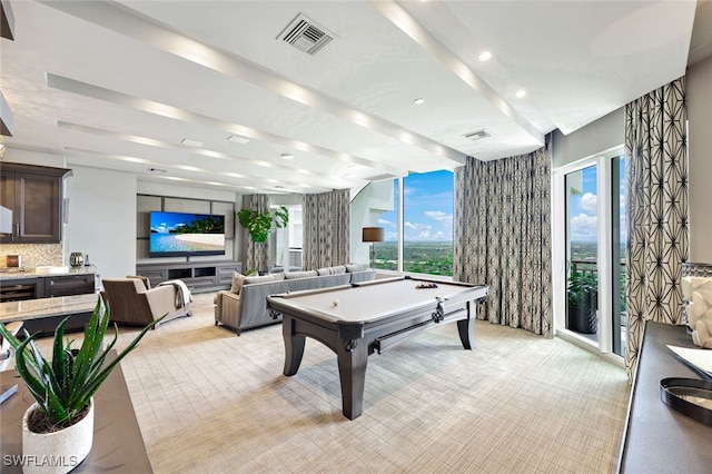 rec room with light colored carpet, pool table, and beamed ceiling