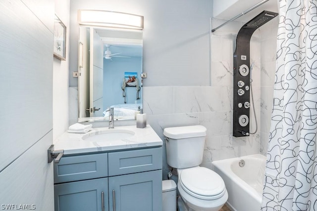 bathroom featuring ceiling fan, toilet, vanity, tile walls, and shower / bath combination with curtain