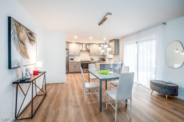 dining room featuring light hardwood / wood-style floors