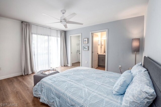 bedroom featuring connected bathroom, hardwood / wood-style flooring, and ceiling fan