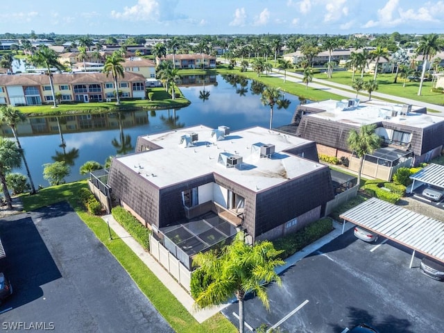 bird's eye view featuring a water view and a residential view