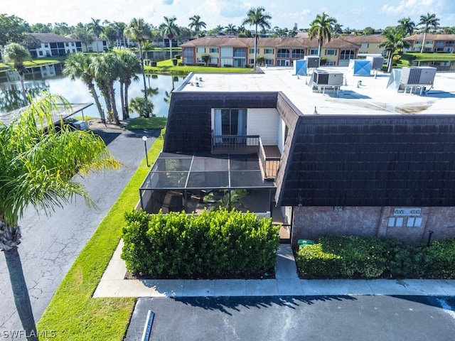 birds eye view of property with a water view