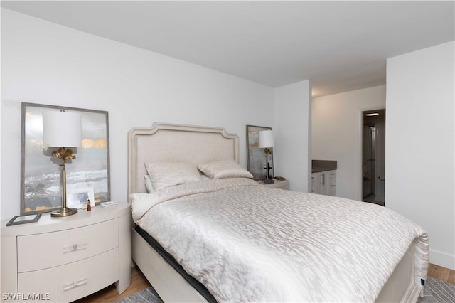 bedroom with light hardwood / wood-style floors