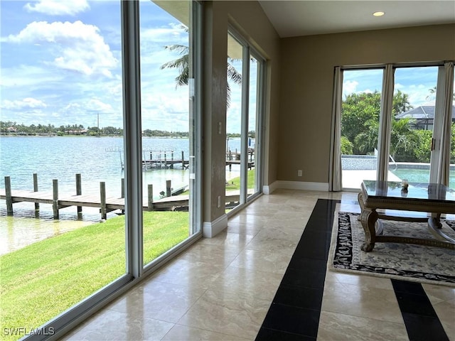 doorway to outside with a water view