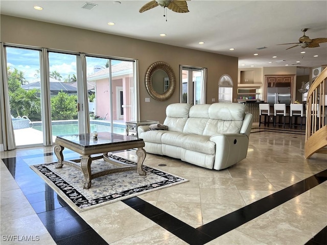 living room featuring ceiling fan