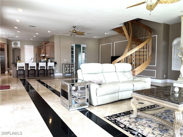 living room featuring ceiling fan