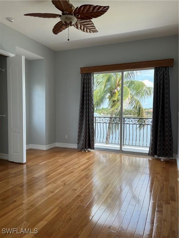 empty room with a healthy amount of sunlight and light hardwood / wood-style flooring