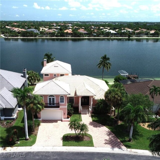 birds eye view of property featuring a water view