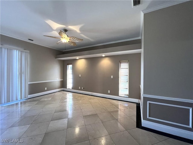 empty room with crown molding, ceiling fan, light tile patterned floors, and a wealth of natural light