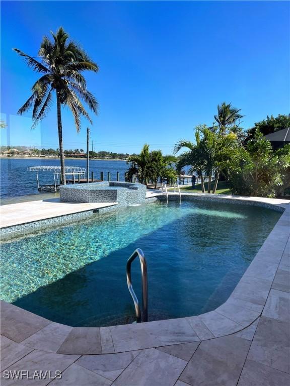 view of pool with a water view