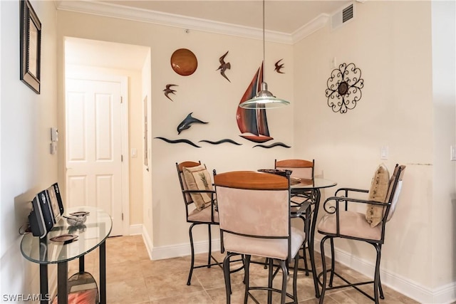 dining space with light tile patterned floors and ornamental molding