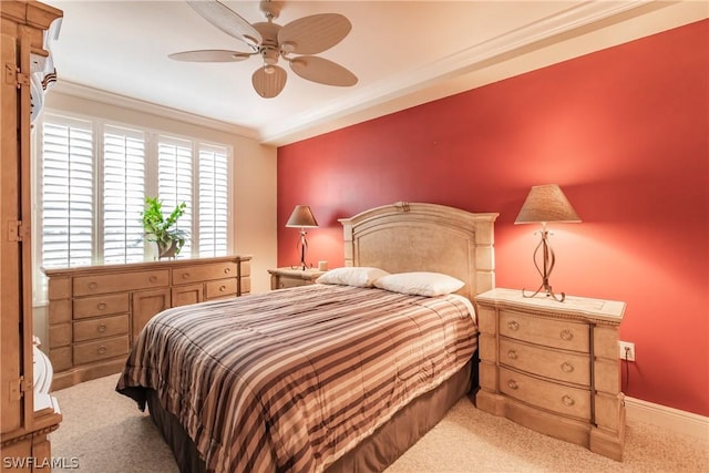 bedroom with crown molding, light colored carpet, and ceiling fan