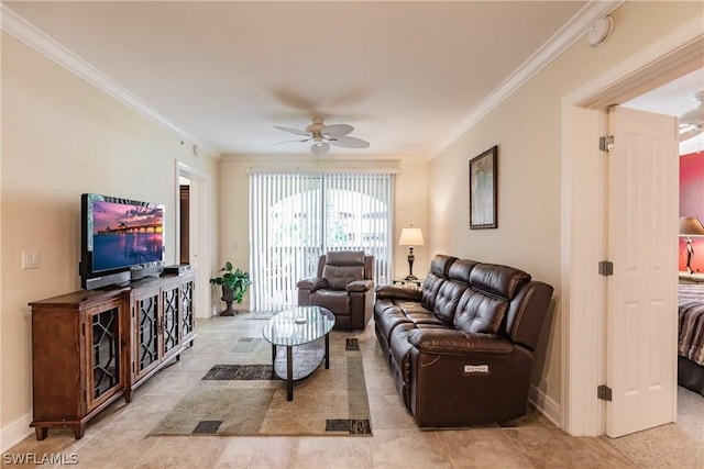 living room with ornamental molding and ceiling fan